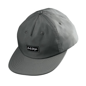 https://cdn.shopify.com/s/files/1/0063/4663/7410/files/WTTW_Flap-Cap_Graphite_02.jpg?v=1731557192